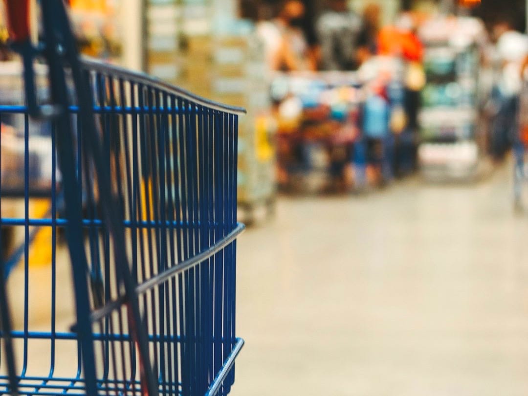blue shopping cart on street during daytime blue shopping cart on street during daytime