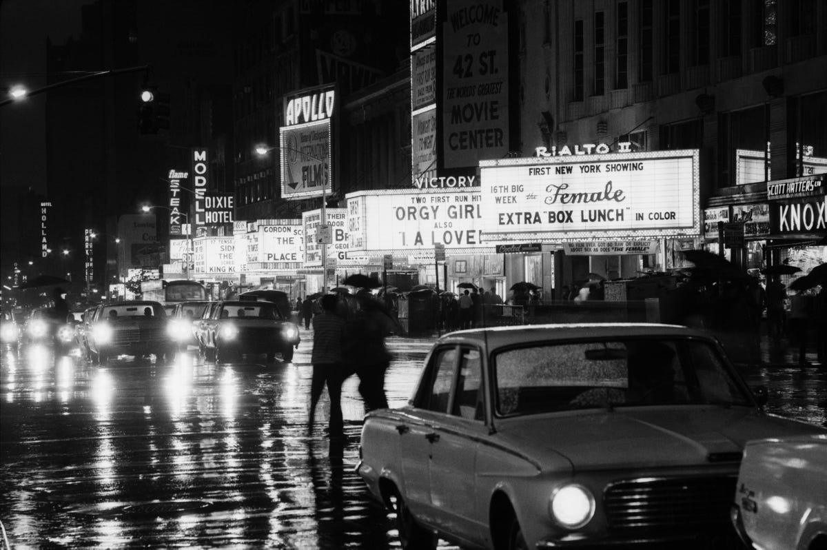 Movie marquees advertise sex-oriented films being shown on 42nd St. in this 1969 photo.