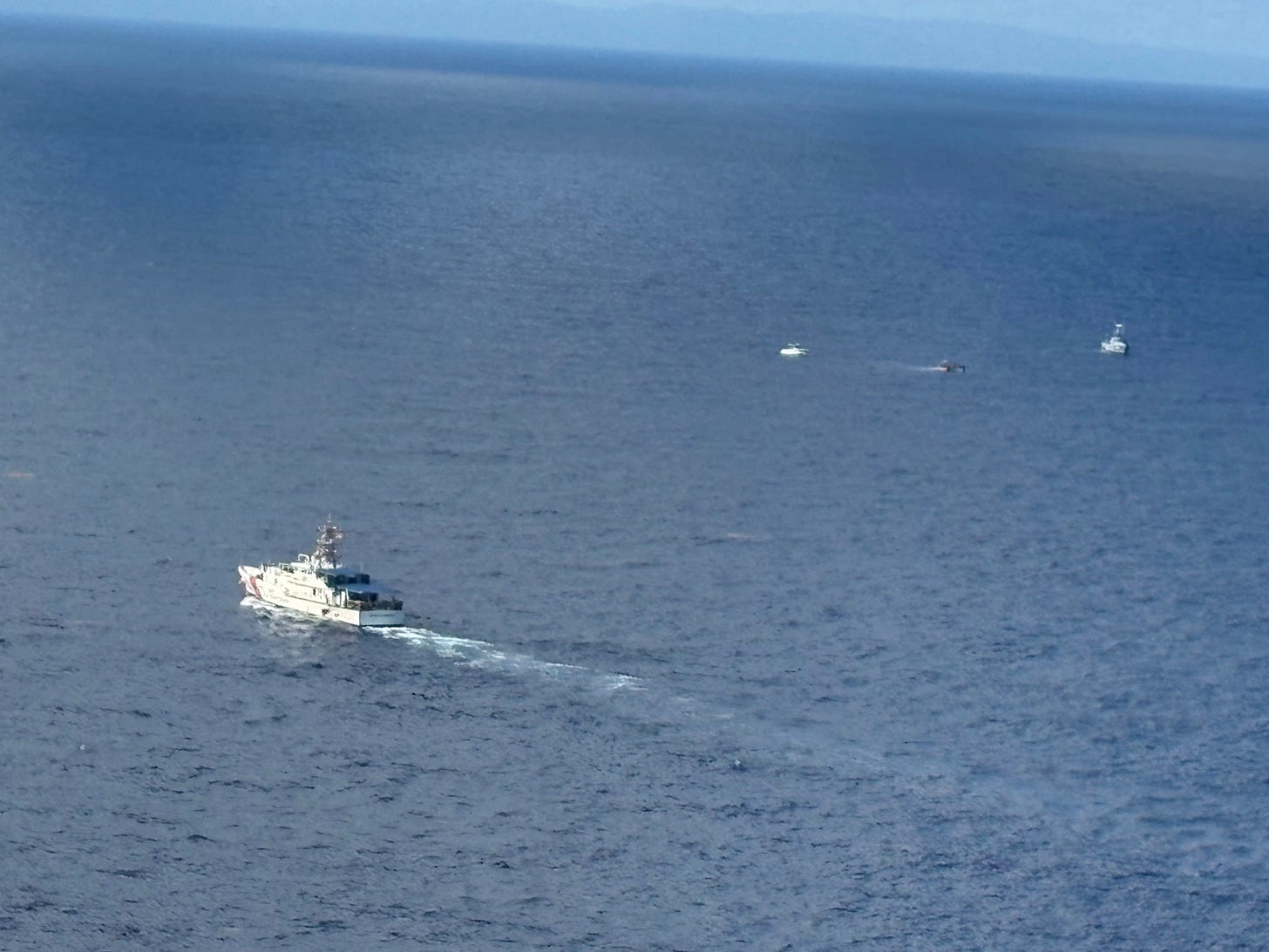 A US Coast Guard Cutter spotted the smuggling vessel taking on water 12 miles off the Dominican Republic. (US Coast Guard photo) A US Coast Guard Cutter spotted the smuggling vessel taking on water 12 miles off the Dominican Republic. (US Coast Guard photo)