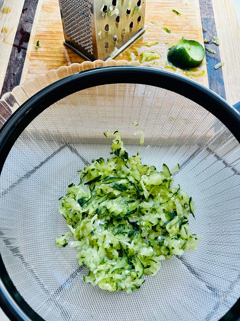 Mediterranean Nachos ingredients, shredded cucumber, roasted eggplant.