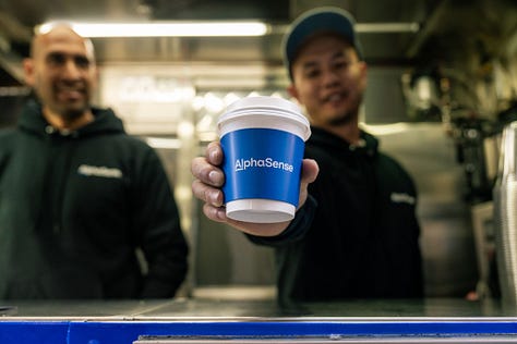 Visual: NYC activation — branded coffee cart near Wall Street, product specialists in conversation.