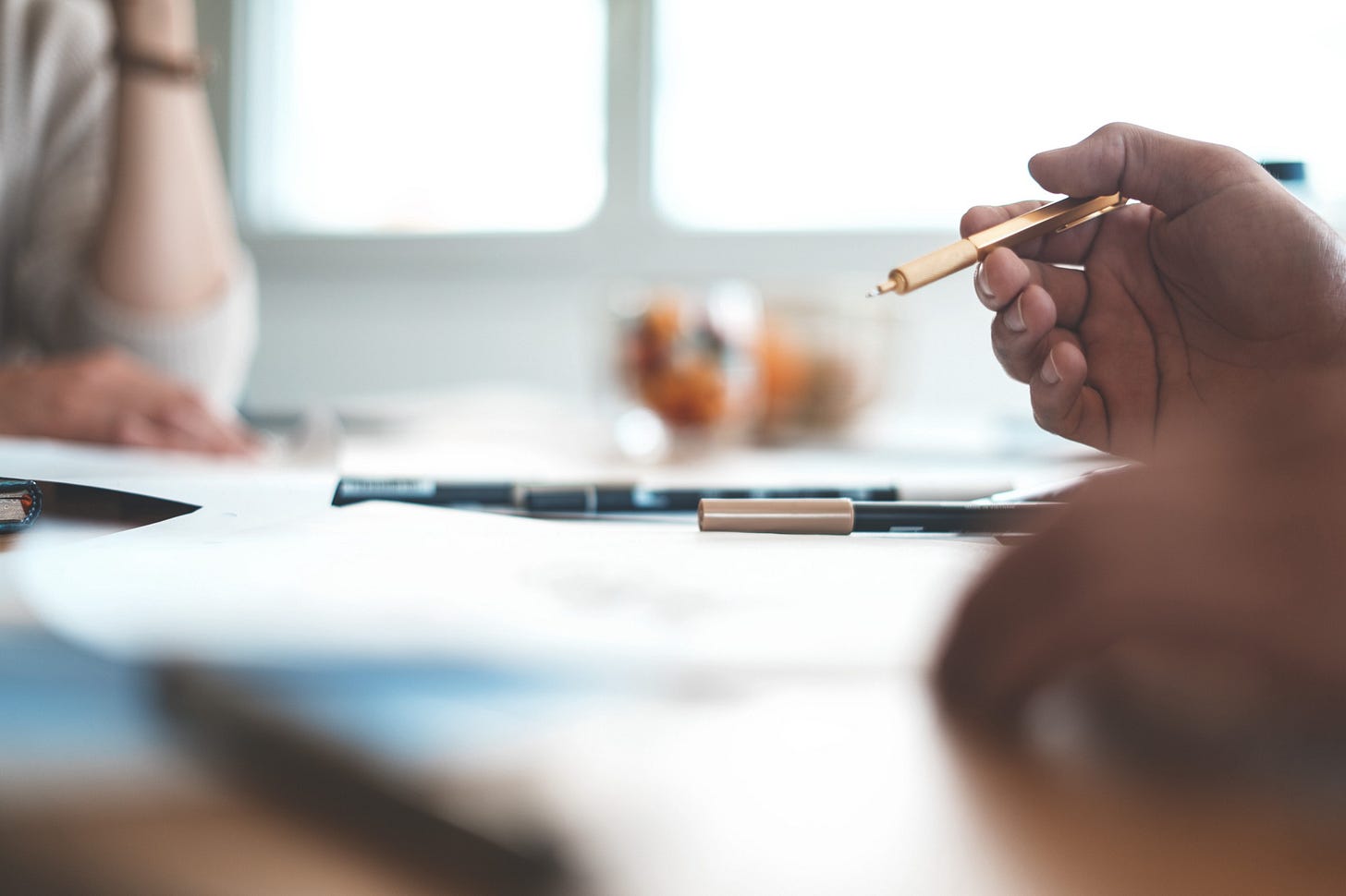 shallow focus photo of person wearing ballpoint pen shallow focus photo of person wearing ballpoint pen