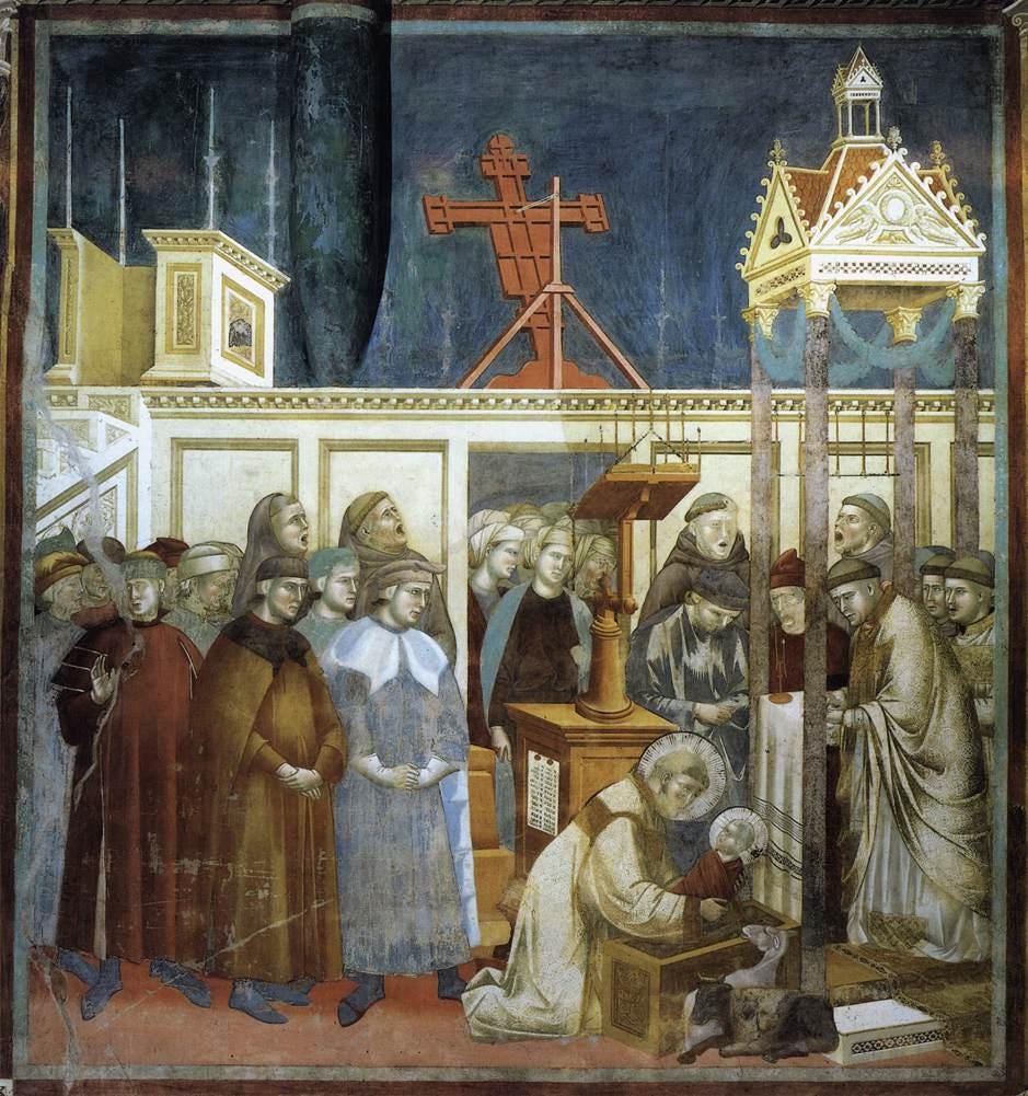 Inside a church choir, friars sing around a large lectern while Saint Francis kneels to lift a tiny child from a manger beside an ox and a donkey, above the screen, a big painted crucifix is seen from behind, tilted toward the nave. Inside a church choir, friars sing around a large lectern while Saint Francis kneels to lift a tiny child from a manger beside an ox and a donkey, above the screen, a big painted crucifix is seen from behind, tilted toward the nave.