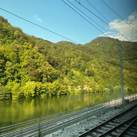 scenic photos of scenery through the train in Slovenia and Austria