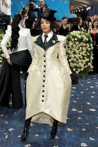 Image may contain Person Adult Wedding Accessories Formal Wear Tie Clothing Footwear High Heel Shoe and Glasses