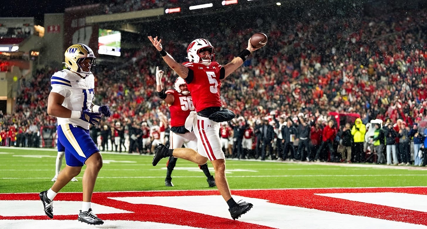 Carter Smith scores a rushing touchdown for Wisconsin at Camp Randall Stadium during the game against Washington. Photo credit UW Athletics.