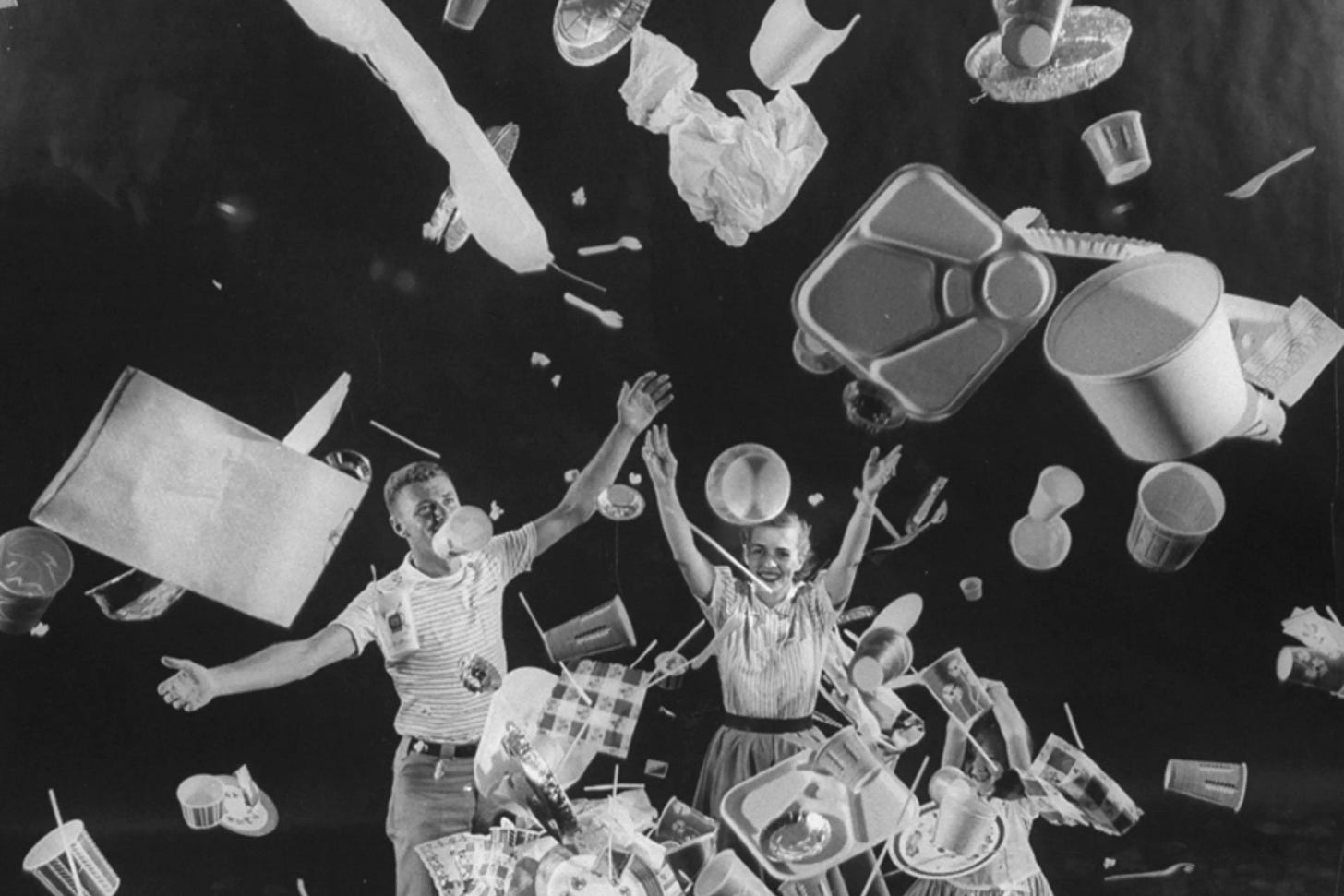 A man, woman and child toss "disposable" items into the air, 1955. A man, woman and child toss "disposable" items into the air, 1955.