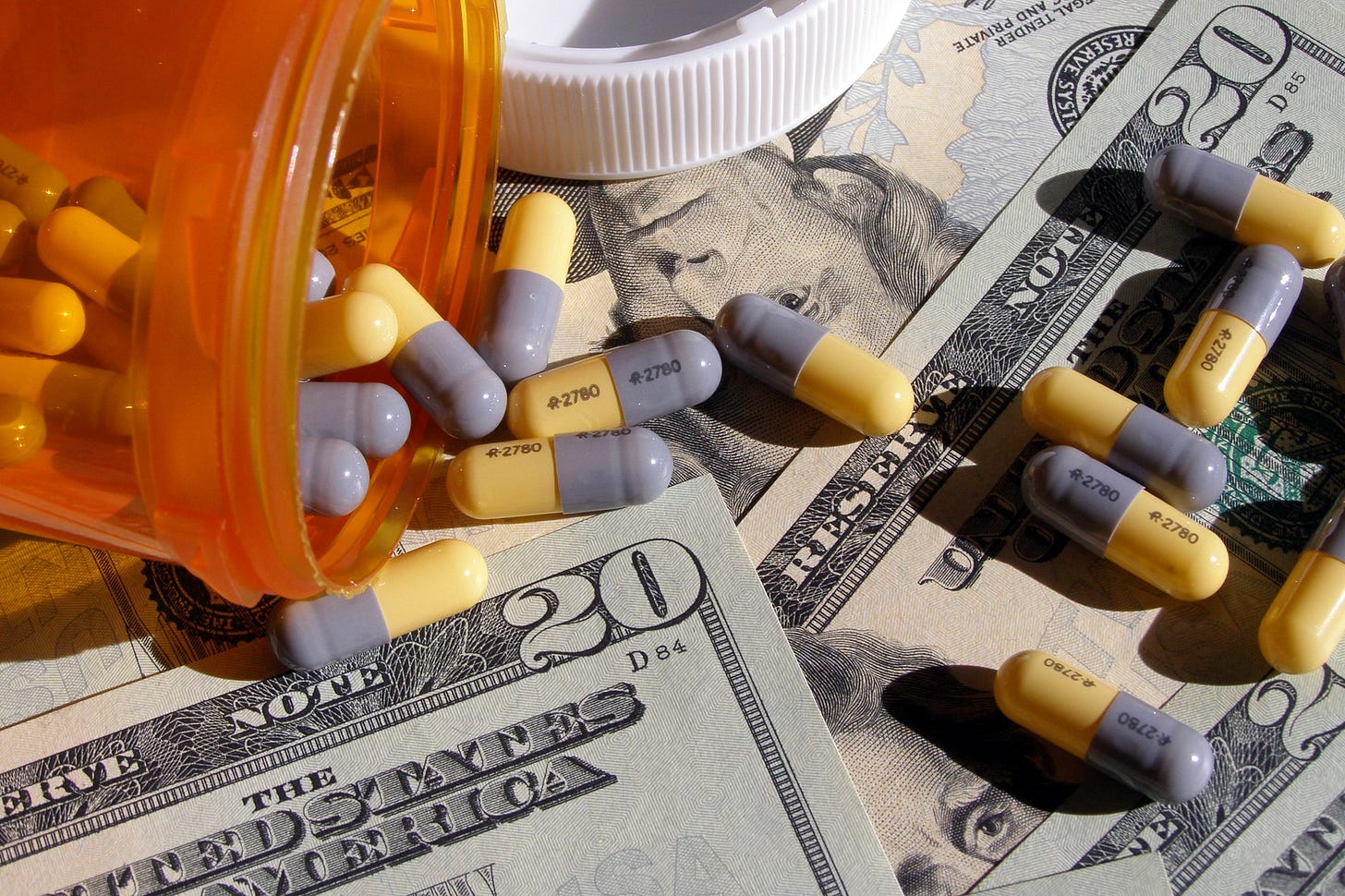 Pills on top of $20 bills