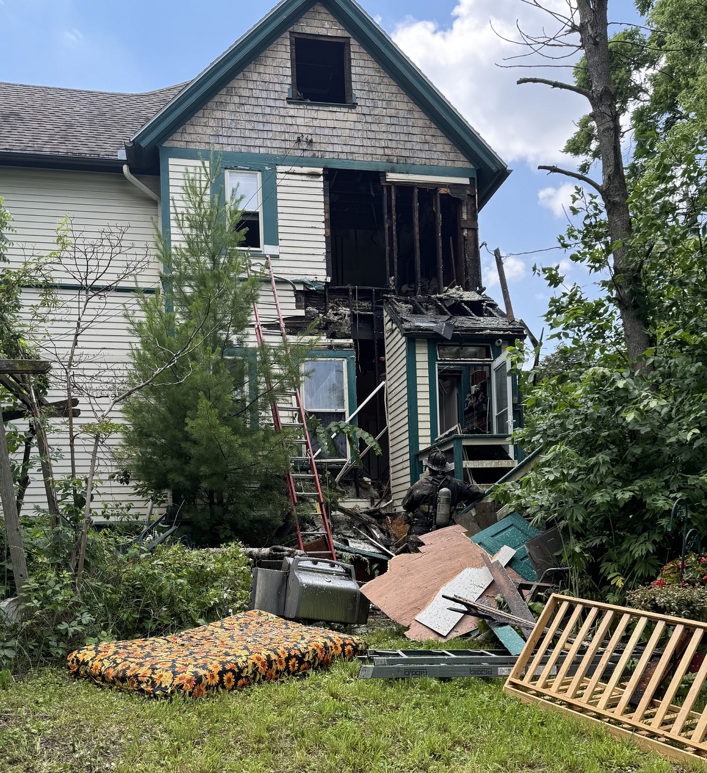 The back of a house damaged by fire. 