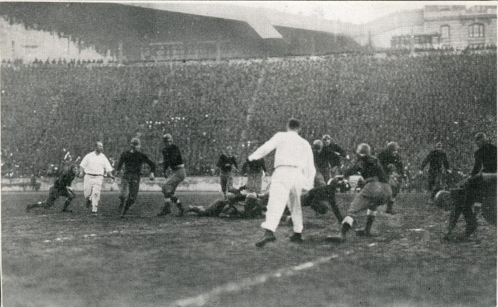 A scene from the Mare Island-Camp Lewis game at Tacoma Stadium. The officials are in all white.