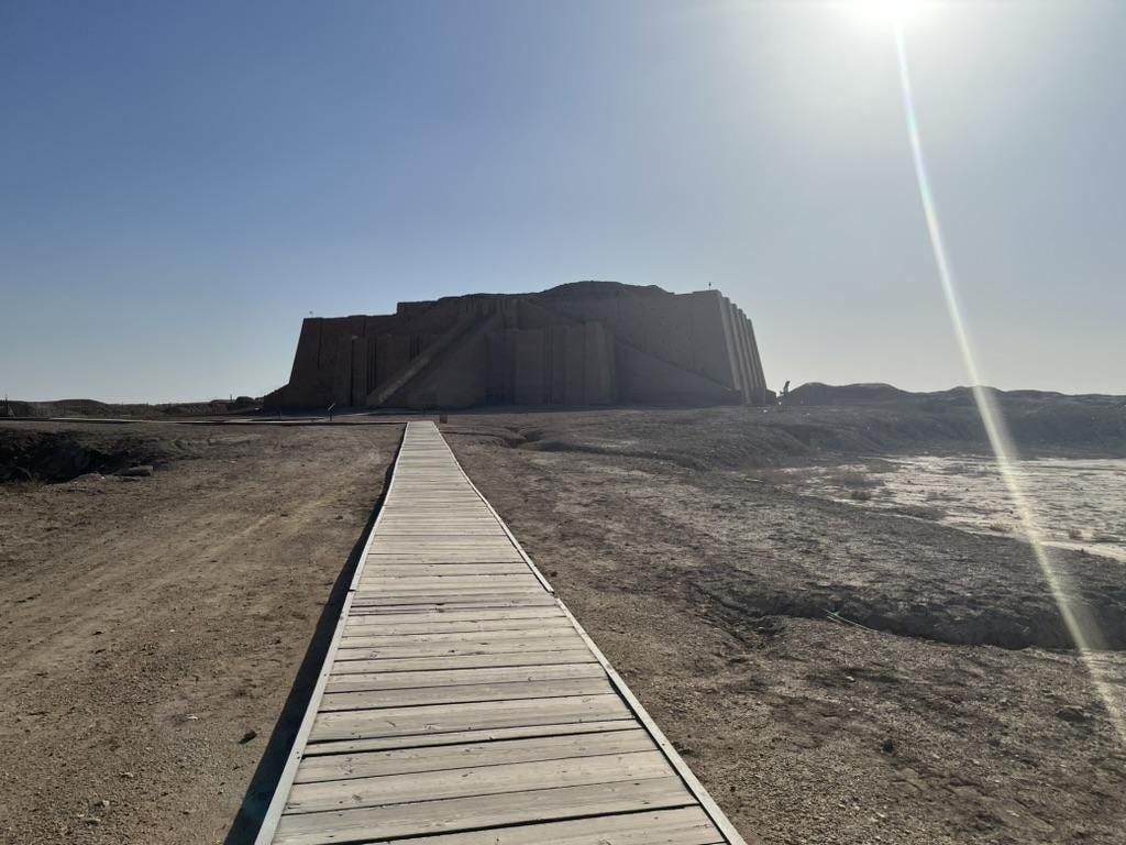 A wooden walkway leading to a building

AI-generated content may be incorrect.