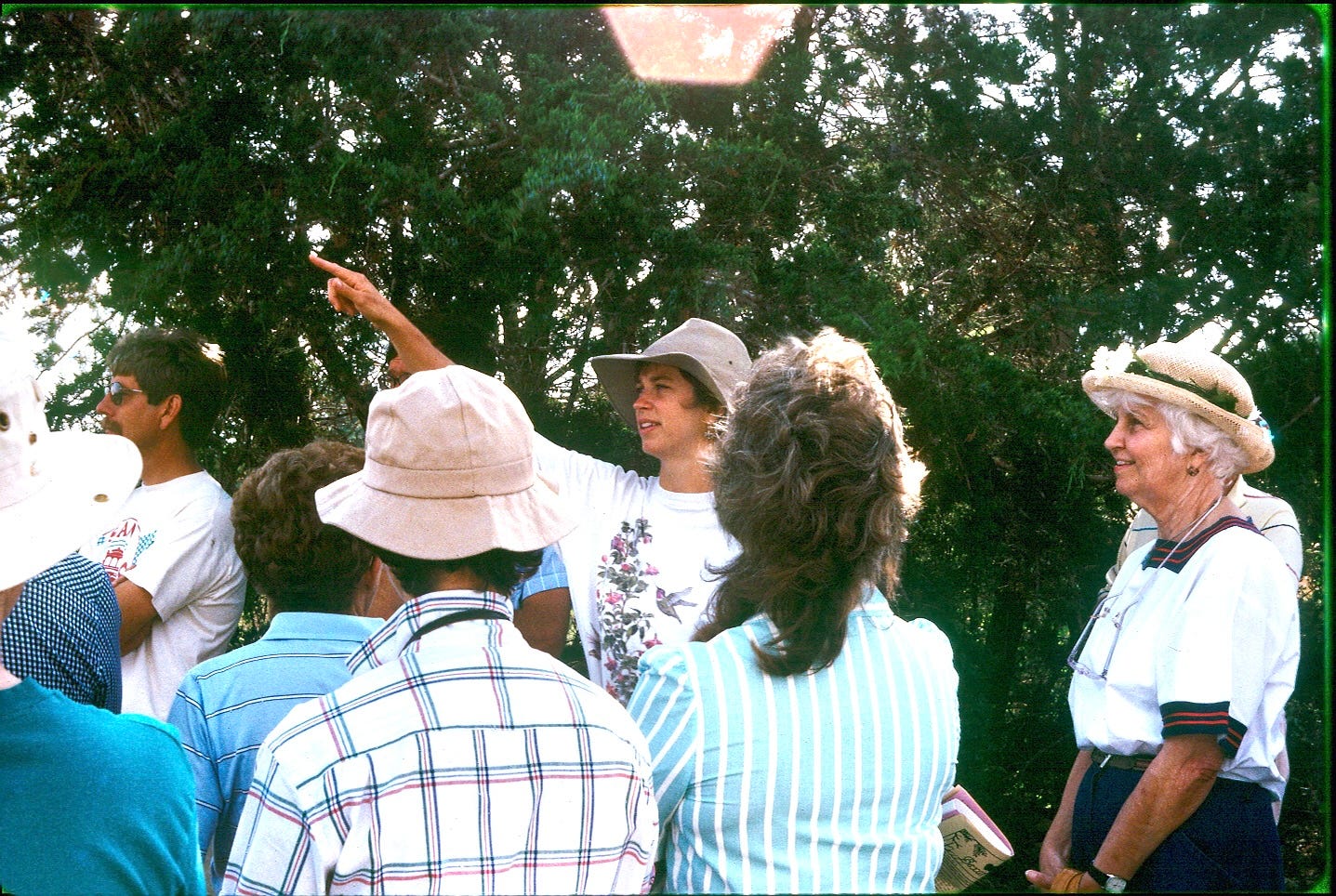 A group of people standing around

AI-generated content may be incorrect.