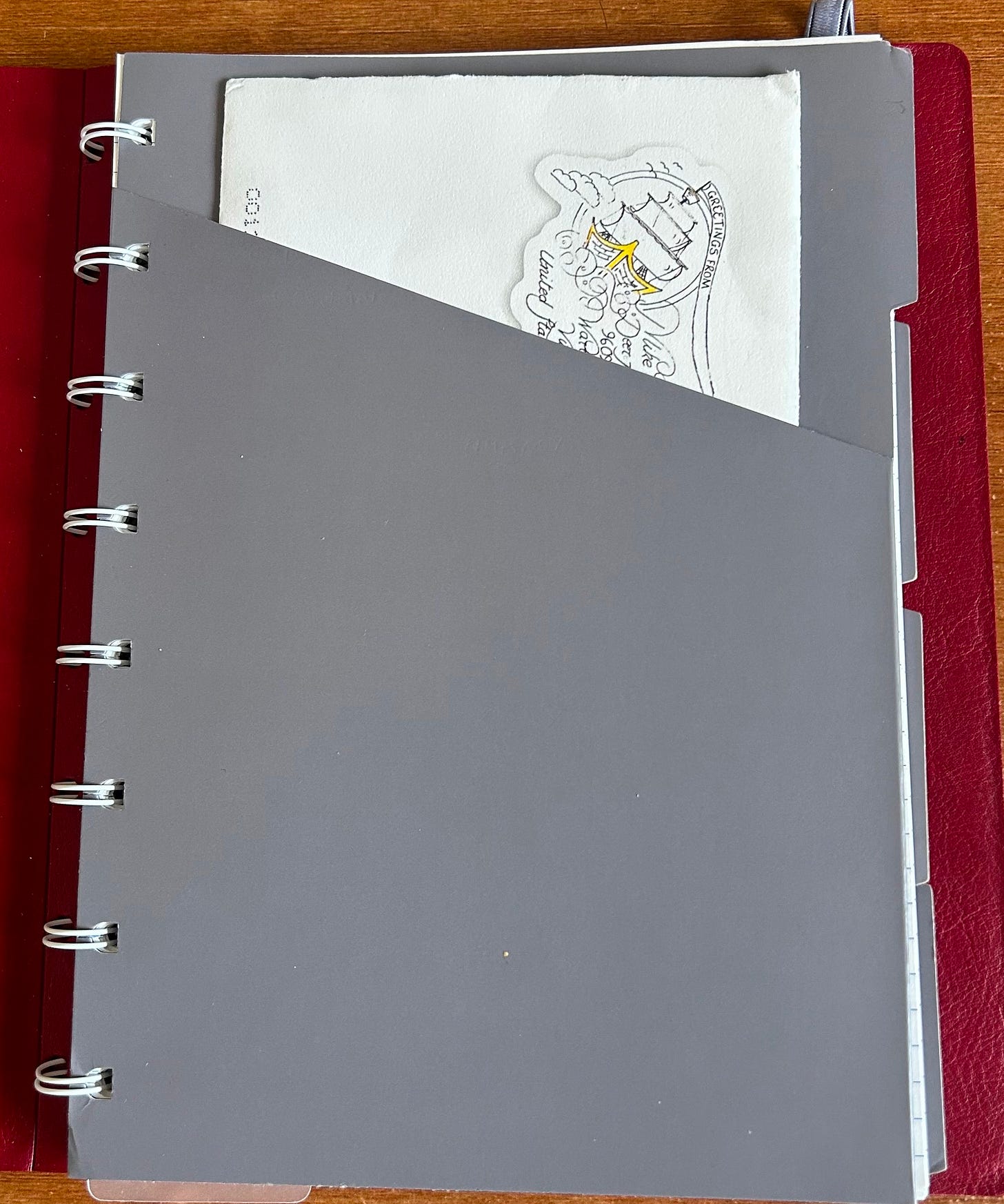 A front divider in the Filofax Refillable Notebook with storage pocket. An envelope is jutting out from the pocket. Photo: Roland Millward A front divider in the Filofax Refillable Notebook with storage pocket. An envelope is jutting out from the pocket. Photo: Roland Millward