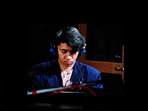 Still images from Tokyo Melody: three photos of Sakamoto recording piano in the studio.