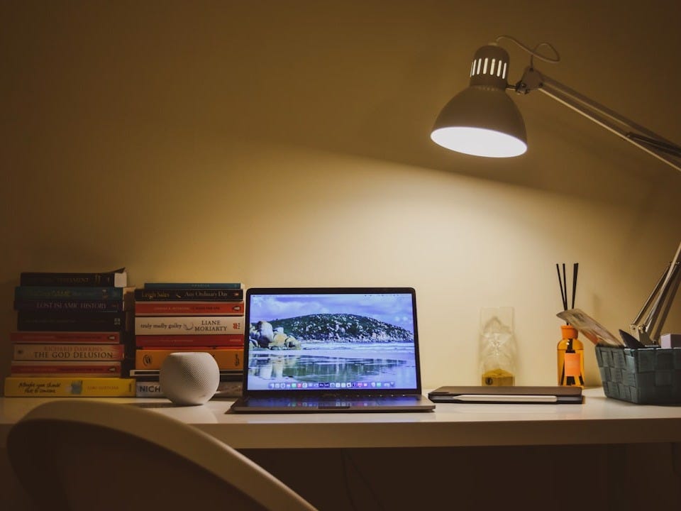 silver imac on white wooden table