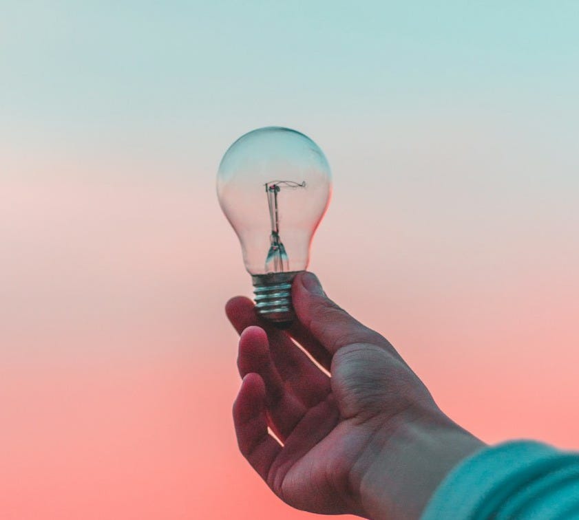 person holding light bulb