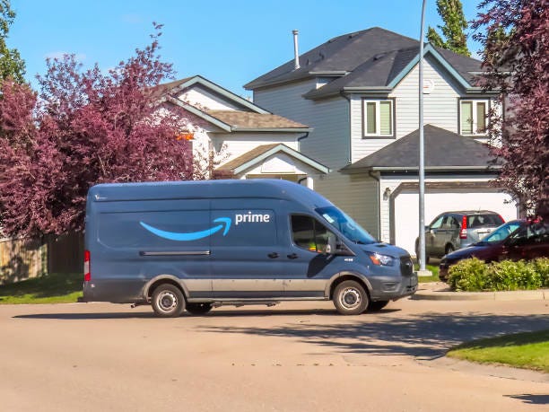 An Amazon delivery shipping truck on the route in a neighbourhood during summer time. Calgary, Alberta, Canada. July 27, 2023. An Amazon delivery shipping truck on the route in a neighbourhood during summer time. Amazon Prime day stock pictures, royalty-free photos & images An Amazon delivery shipping truck on the route in a neighbourhood during summer time. Calgary, Alberta, Canada. July 27, 2023. An Amazon delivery shipping truck on the route in a neighbourhood during summer time. Amazon Prime day stock pictures, royalty-free photos & images