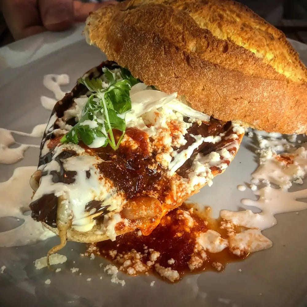 Bread roll filled with a stuffed chile