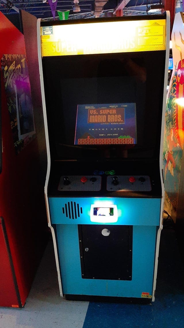 r/retrogaming - An actual Vs Super Mario Bros machine in an arcade. I've never seen one in person.