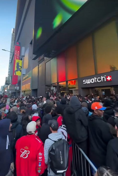 Nine-panel grid of social media screenshots and news footage capturing the chaotic global rollout of the Swatch x Audemars Piguet Royal Pop collaboration. Top row shows uniformed police officers stationed outside a Swatch boutique with the caption "It is the last day of the," a massive crowd packed shoulder-to-shoulder on a Manhattan street in front of "The Lion King" Broadway theatre near Times Square, and a blurred storefront image suggesting motion or commotion. Middle row shows a confrontation between police and individuals on a city street captioned "Losing their freedom," another angle of the dense Times Square crowd in front of the Lion King theatre with people raising phones to film, and an overhead view of a packed crowd outside a Swatch storefront. Bottom row shows a quiet shot of someone walking past a closed boutique captioned "Things getting crazy at the AP X Swatch lineup in Montreal" with a Canadian flag emoji, police officers detaining or speaking with individuals inside a building with the caption "in Miami shutdown," and a dark cinematic still featuring a dimly lit restaurant or bar interior with the text "It's from this new Swatch collab called the Royal Po—" overlaid. The collage documents the global scale of the disruption — from New York and Montreal to Miami — and the police response that accompanied multiple store closures during the Royal Pop launch.