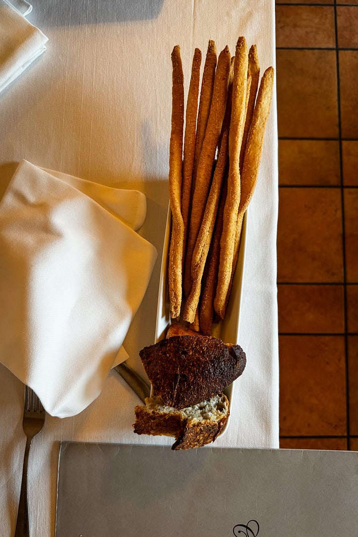 Purple carrot fried ravioli and a bundle of grissini