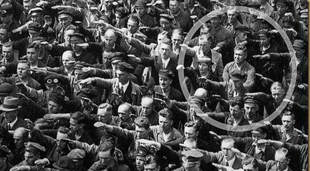 A group of people in uniform saluting

AI-generated content may be incorrect.