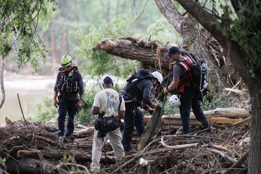 Search-and-rescue crews comb debris on Monday after devastating floods hit near the Guadalupe River in Ingram, Texas. Photograph: Jorge Salgado/Anadolu via Getty Images