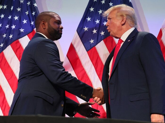Rep. Byron Donalds (R-FL) shakes hands with former U.S. President Donald Trump during the Moms for Liberty Joyful Warriors national summit at the Philadelphia Marriott Downtown on June 30, 2023 in Philadelphia, Pennsylvania.