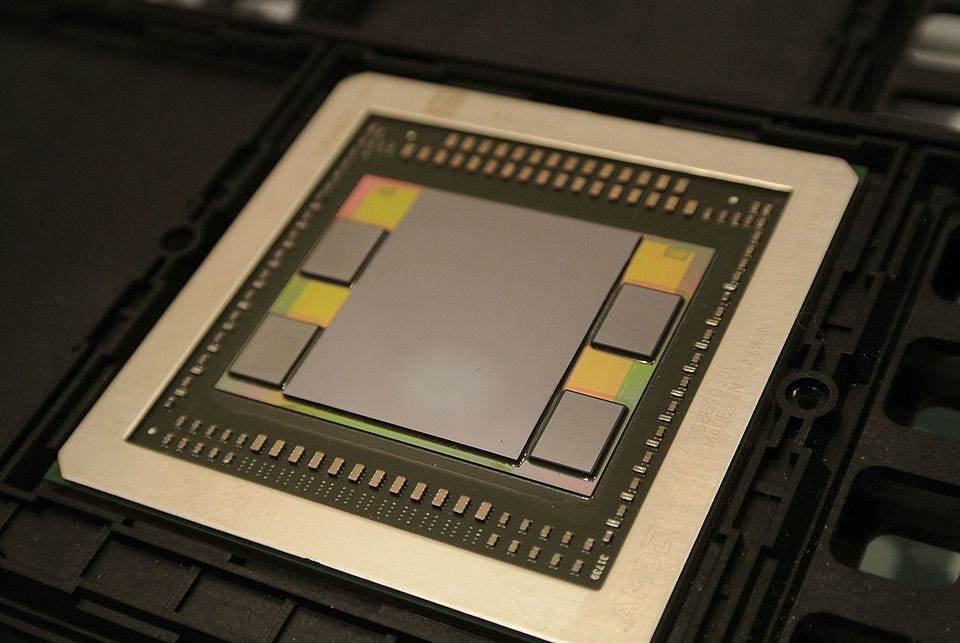 Close-up of a GPU package with high-bandwidth memory placed around the processor. Close-up of a GPU package with high-bandwidth memory placed around the processor.