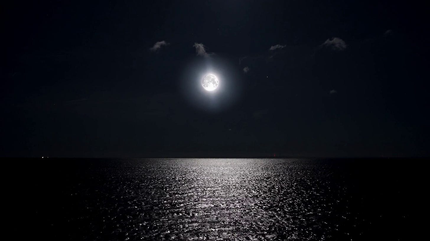 Full moon at night reflecting on the water. Alpha channel moonlight bright  sea reflection. Clear big distinct moon glowing over the ocean in eerie  night scene.