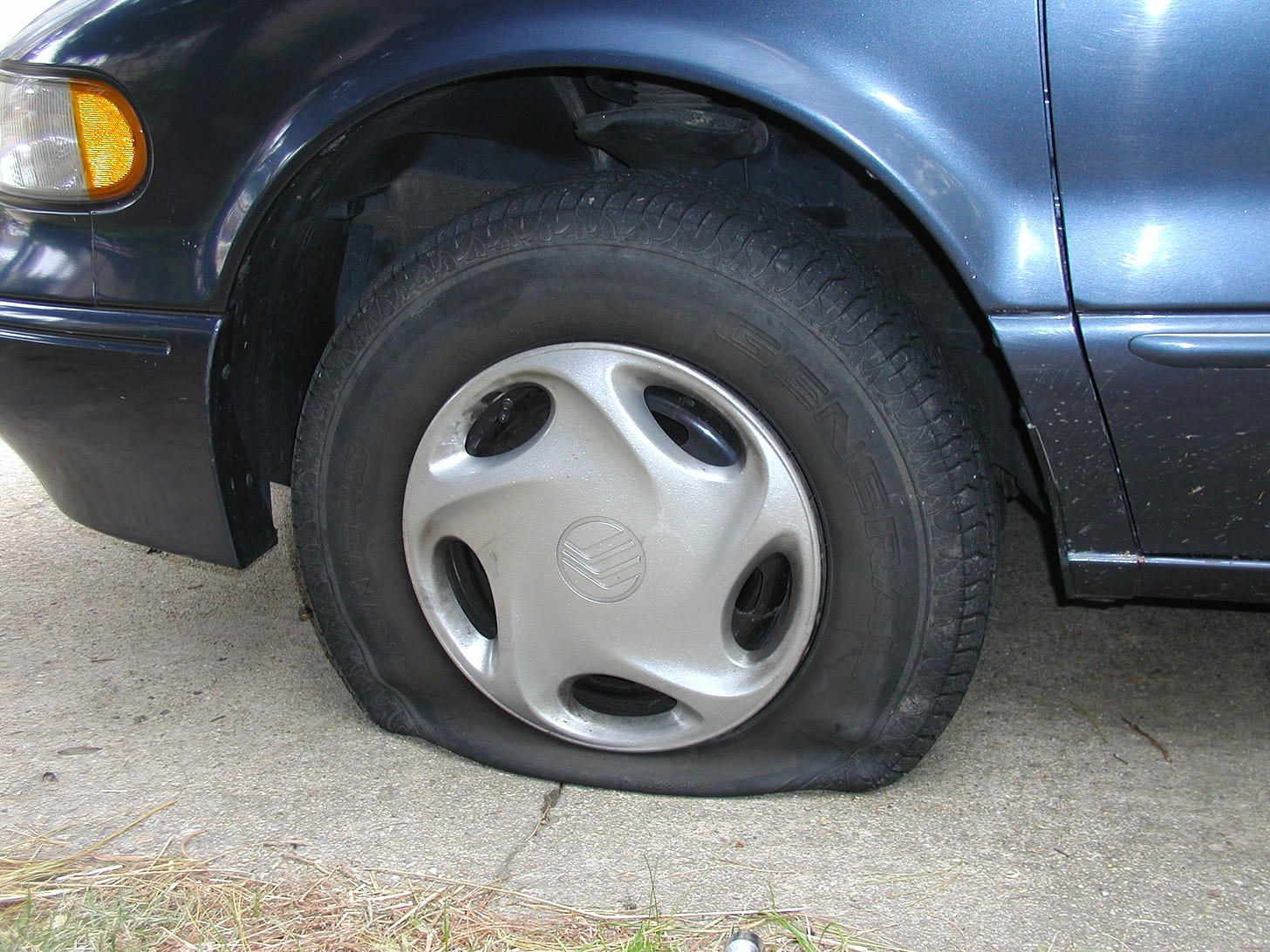 Photo of a flat tire Photo of a flat tire
