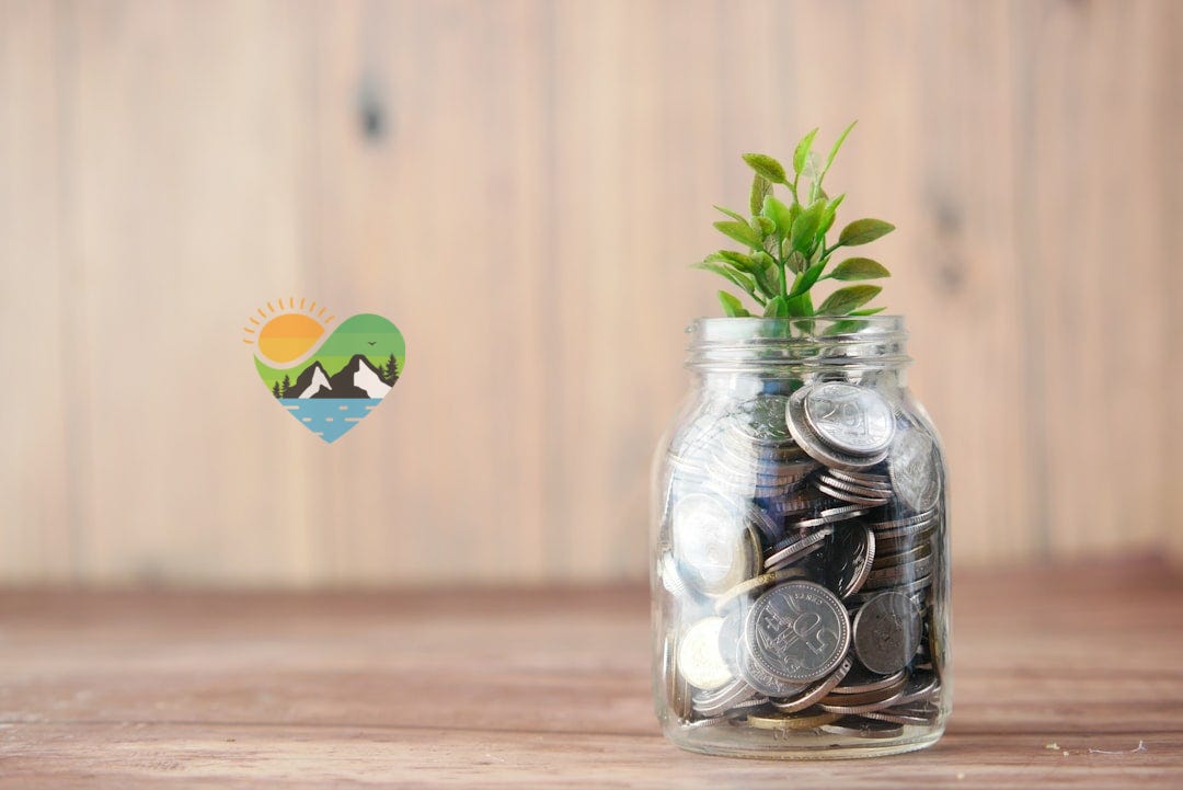 a glass jar filled with coins and a plant