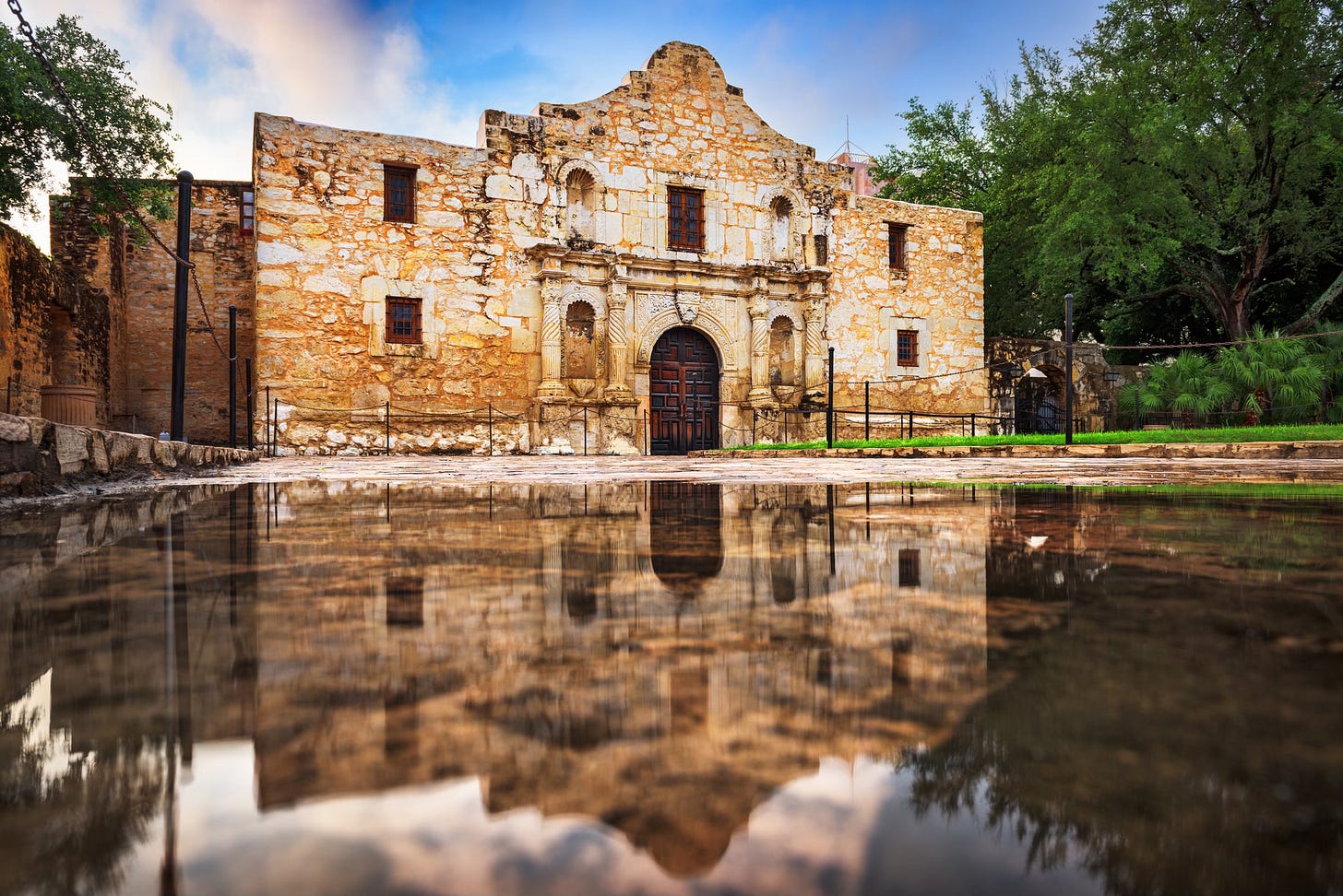 The Alamo in San Antonio, Texas, USA with puddle reflections.