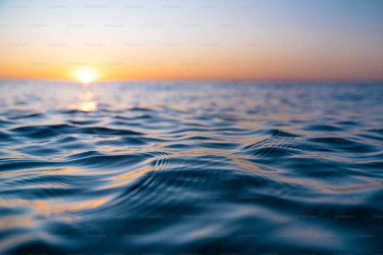 the sun setting over clouds