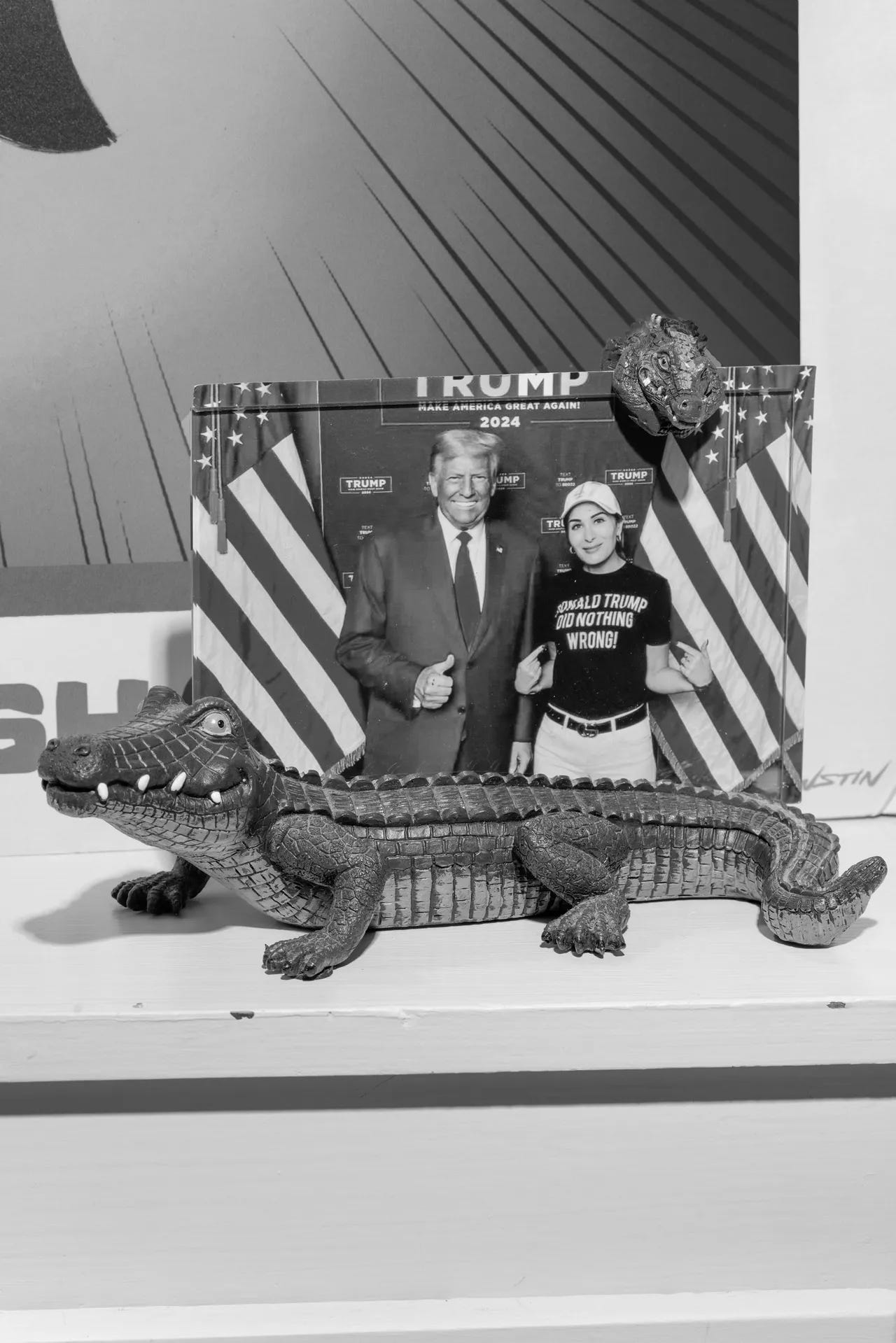 A photograph of a woman posing with President Donald Trump