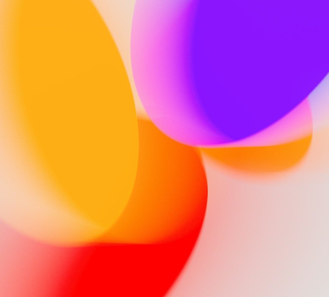 A close up of a colorful object on a white surface A close up of a colorful object on a white surface
