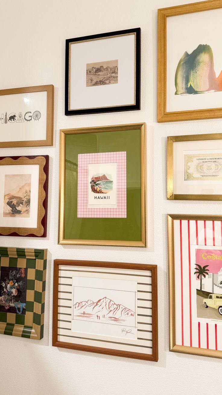 This may contain: a wall with many framed pictures on it