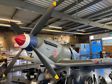 Inside Britain’s Spitfire and Hurricane Museum visitors walk through the preserved memory of the Second World War. Restored Supermarine Spitfires stand beside the weapons, uniforms, flight equipment and personal artefacts of the young pilots who flew them. From cockpit instruments and oxygen masks to bombs mounted beneath the aircraft’s wings, the collection reveals both the engineering brilliance and the human stories behind the fighter that became a symbol of Britain’s survival during the Battle of Britain.