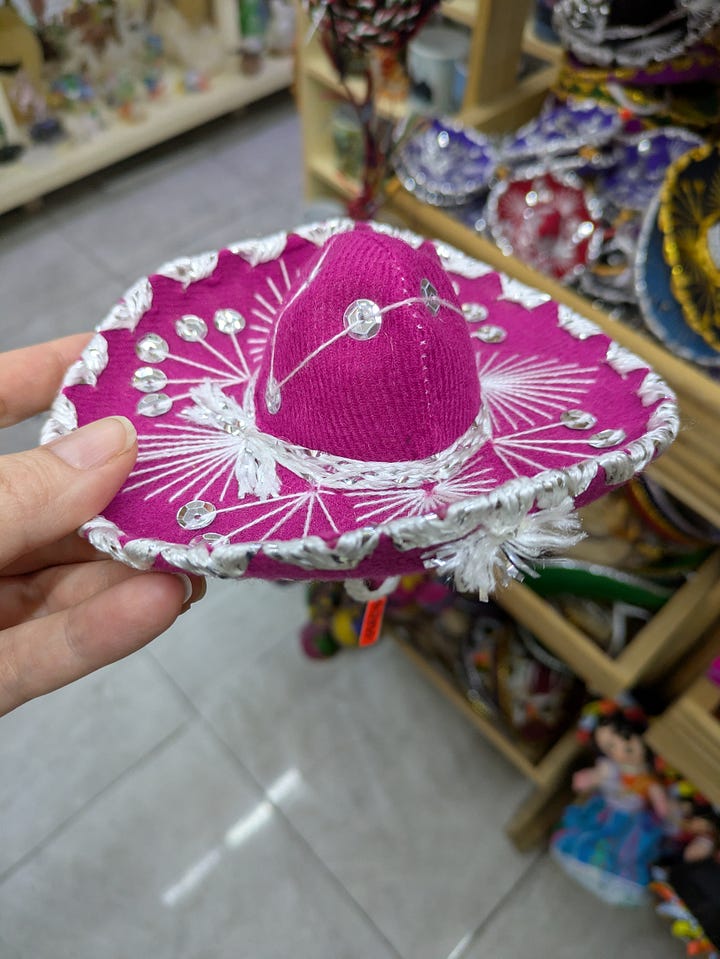 Cat sombrero I failed to purchase. Some tacos we enjoyed on just such a walk.