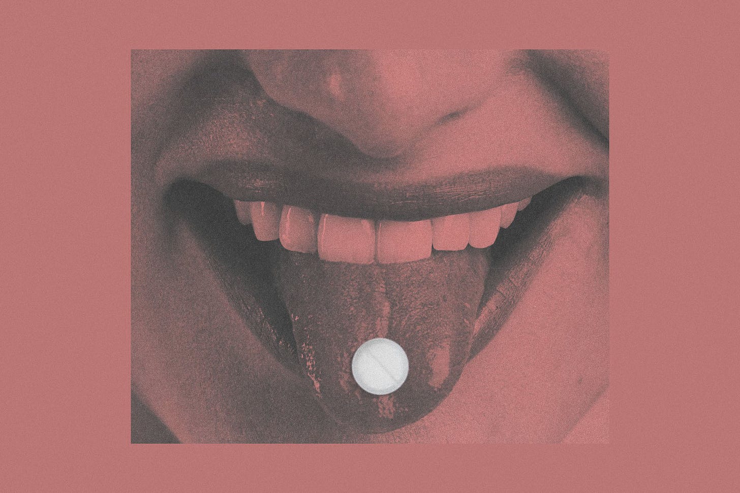 a close up on the bottom half of a face with a tongue out and a pill on the tongue