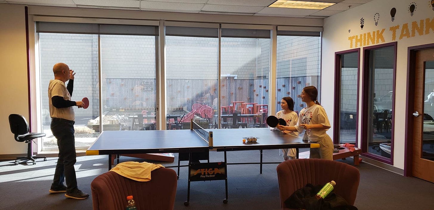May be an image of 3 people, table and indoor