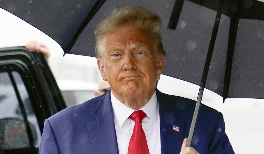 Former President Donald Trump walks to speak with reporters before boarding his plane at Ronald Reagan Washington National Airport, Aug. 3, 2023, in Arlington, Va. The federal judge overseeing the 2020 election conspiracy case against Donald Trump will hear arguments over a request by prosecutors for a protective order seeking to bar the former president from publicly disclosing evidence shared by the government. (AP Photo/Alex Brandon, File)