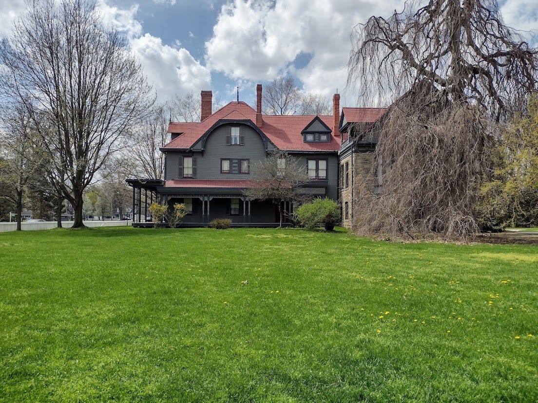 Large two story house with gabled roof