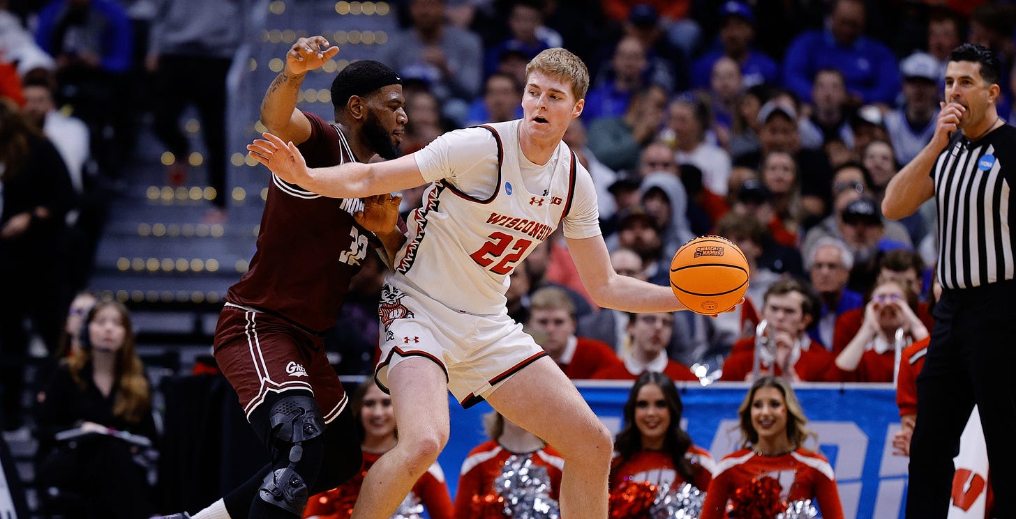 Wisconsin Badgers forward Steven Crowl backs down a Montana Grizzlies player in the first Round of the NCAA Tournament at Ball Arena Wisconsin Badgers forward Steven Crowl backs down a Montana Grizzlies player in the first Round of the NCAA Tournament at Ball Arena