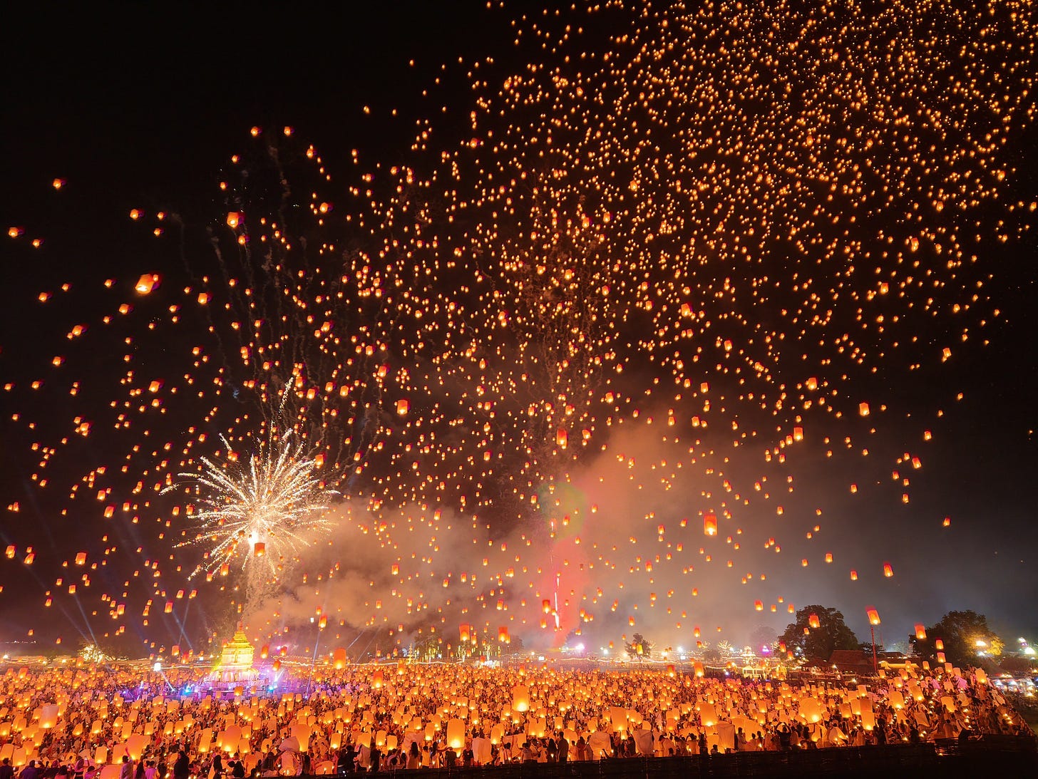 As dusk envelops Chiang Mai, thousands of glowing lanterns are released into the nite sky, creating a stunning canopy of light over the city’s temples and mountains. The Yi Peng Festival is rooted in the traditions of the Lanna Kingdom in Northern Thailand, which is considered a symbolic act to release misfortune and make wishes for the future. Yi Peng is held in conjunction with the full moon of the second month in the Lanna lunar calendar. As dusk envelops Chiang Mai, thousands of glowing lanterns are released into the nite sky, creating a stunning canopy of light over the city’s temples and mountains. The Yi Peng Festival is rooted in the traditions of the Lanna Kingdom in Northern Thailand, which is considered a symbolic act to release misfortune and make wishes for the future. Yi Peng is held in conjunction with the full moon of the second month in the Lanna lunar calendar.