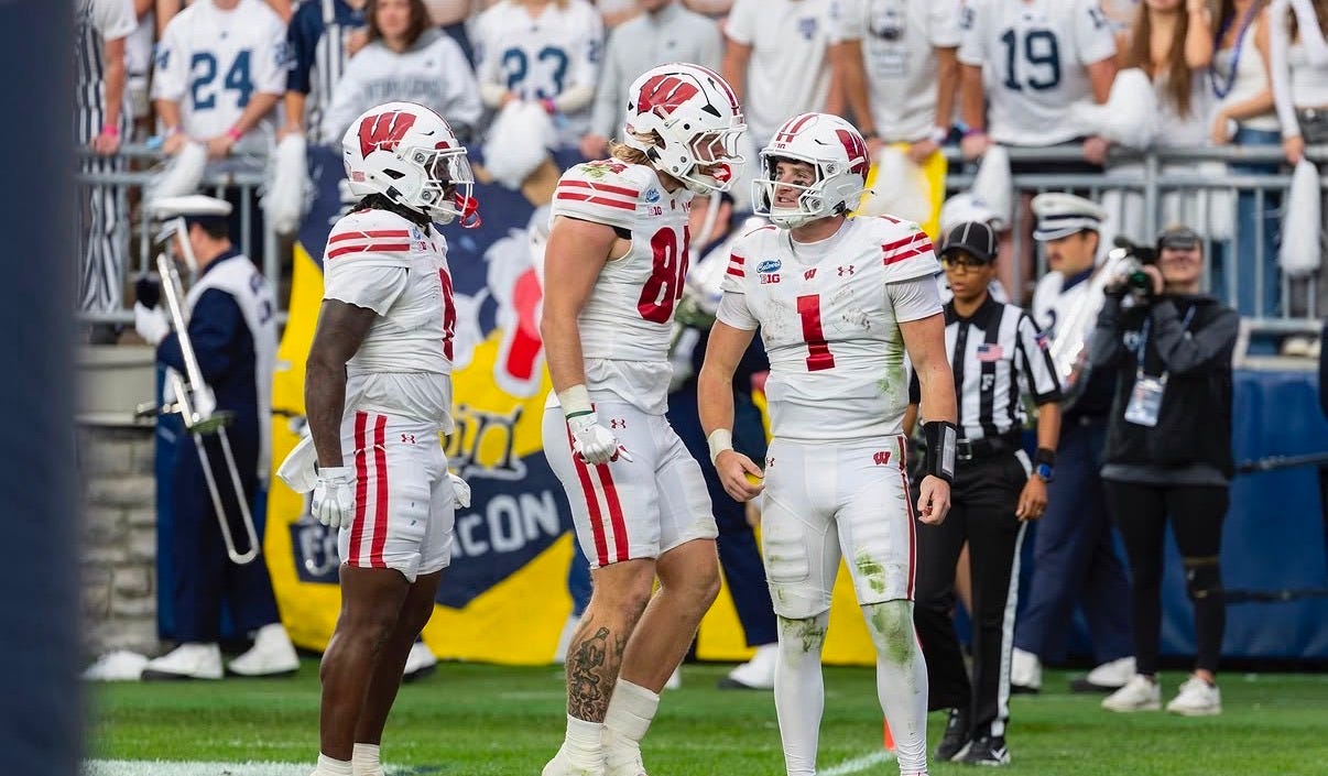 Wisconsin quarterback Colton Joseph celebrates with teammates during the Badgers’ win over Penn State.