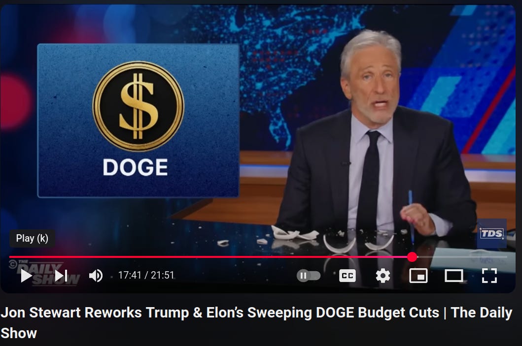 A still from 17:41 into a daily show episode with Jon Stewart talking with the Dodgy DOGE logo beside him. The title of the video is Jon Stewart Reworks Trump & Elon's Sweeping DOGE Budget Cuts