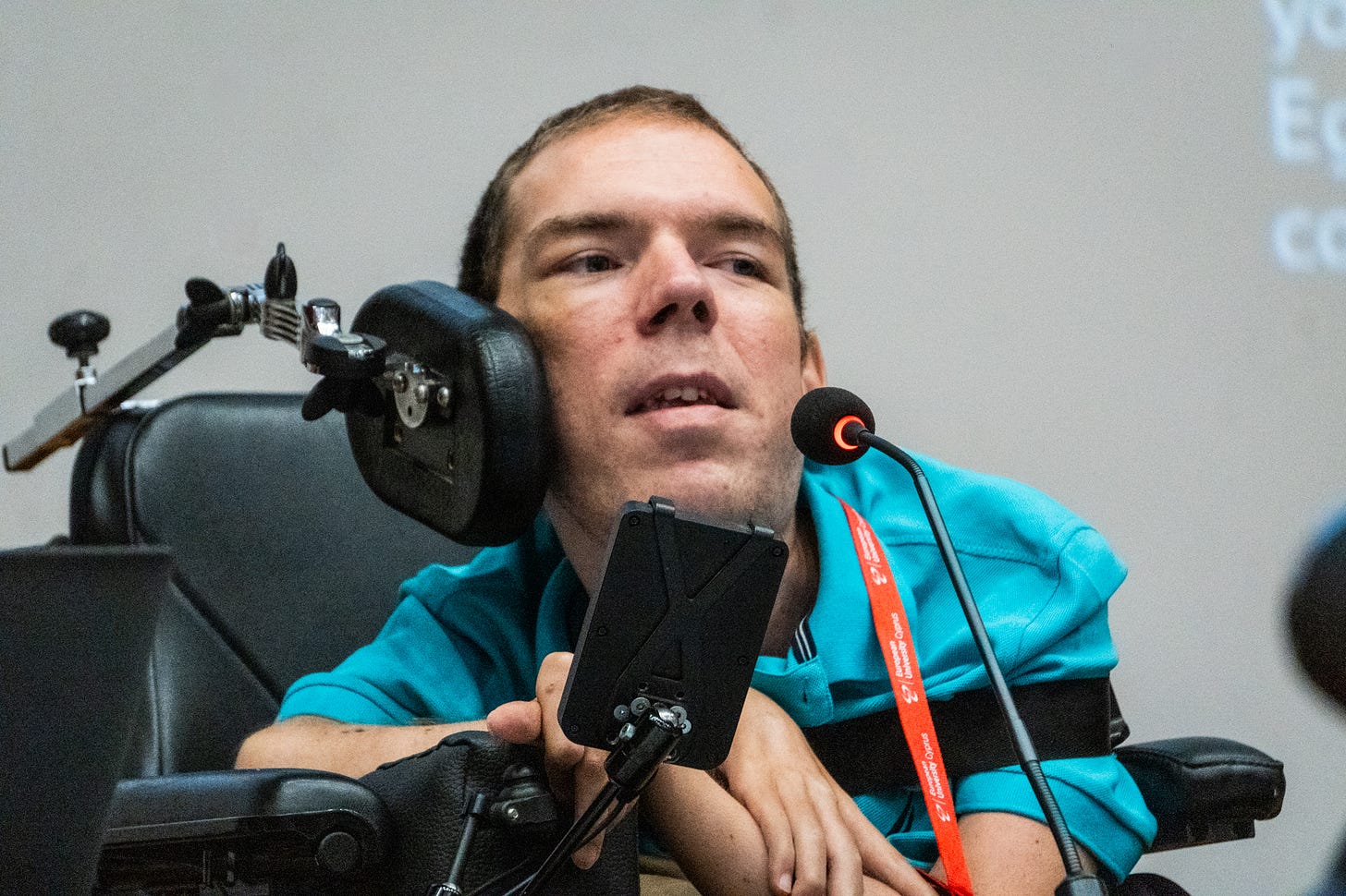 Me talking to a microphone on a panel Me talking to a microphone on a panel