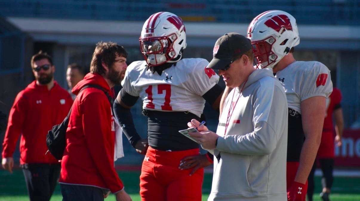 Wisconsin Badgers tight ends coach Nate Letton on the field during fall camp practice.