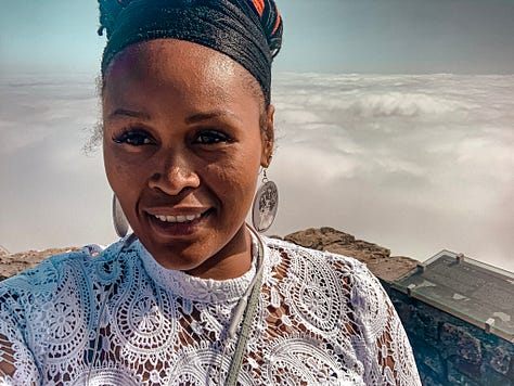 Dr. CK taking photos at the top of Table Mountain in Capetown, South Africa